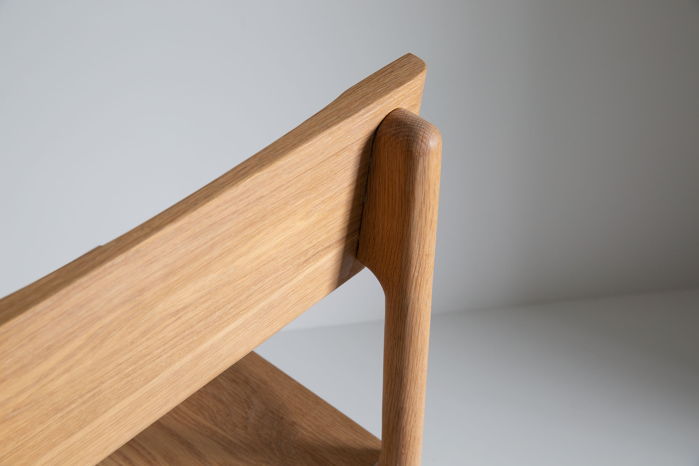 Close-up of chair top rail and joint where backrest meets post