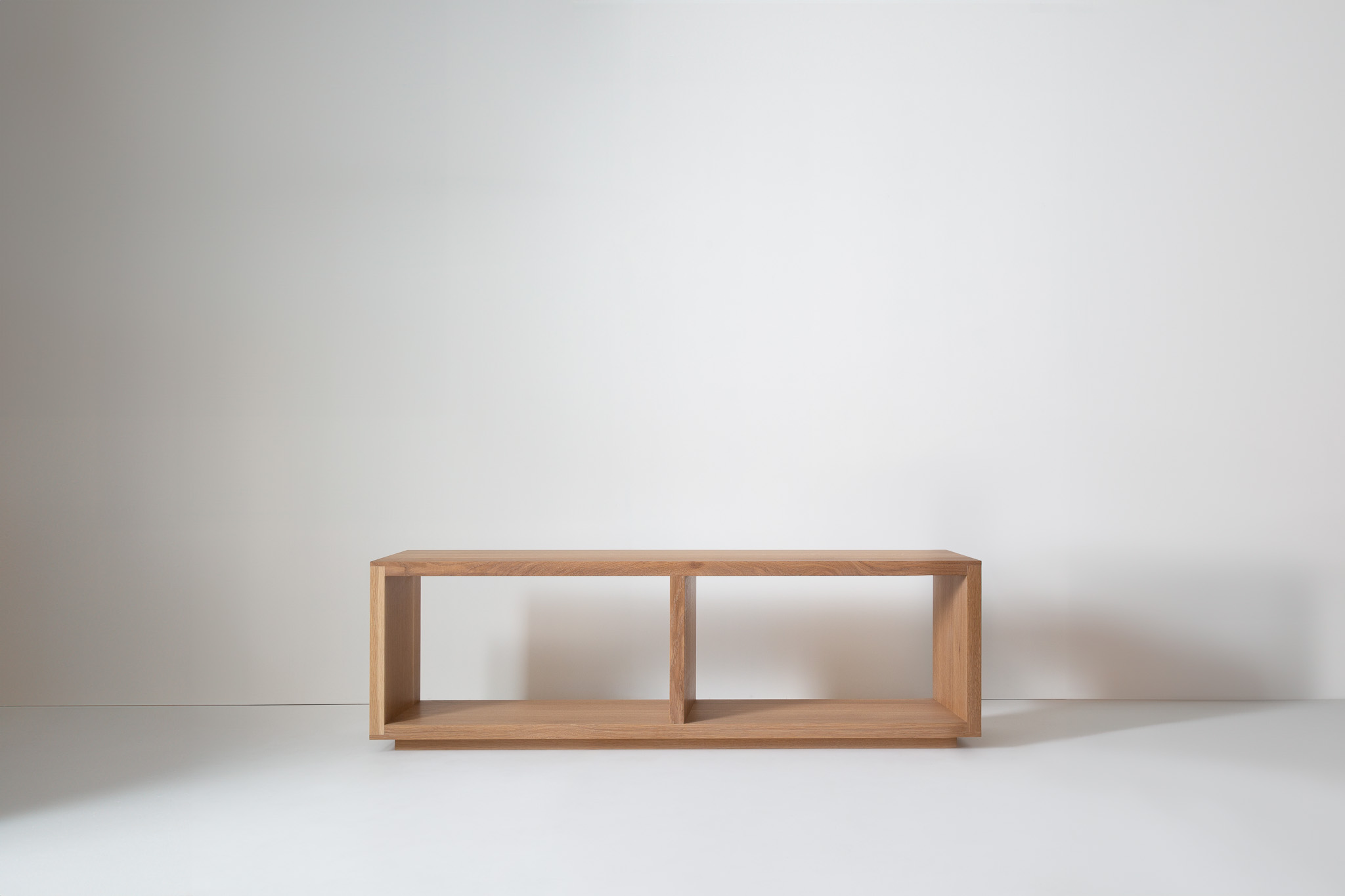 Curtain backdrop with wooden bench and blue cushion