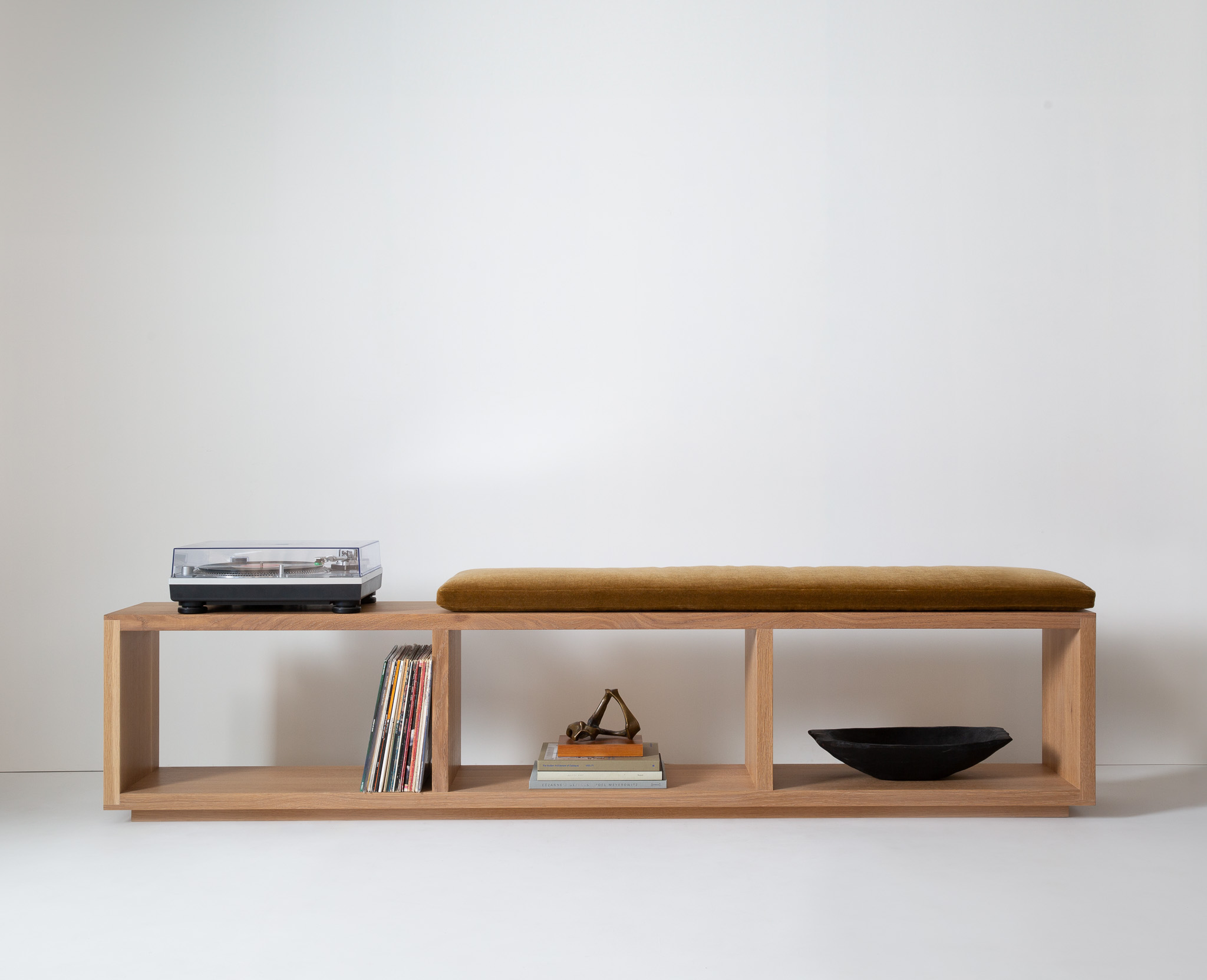 Long wooden bench with open cuboid compartments, no cushion
